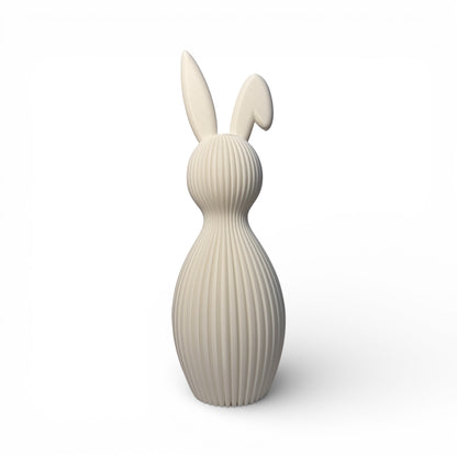 Ein Osterhase mit gefaltetem Ohr in weiß