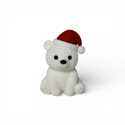 Gestrickter Eisbär mit Weihnachtsmütze